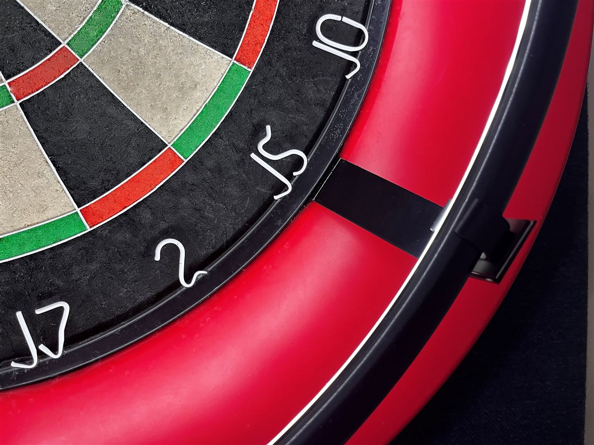 Close-up of a 3sixty mounting post fitted between the dartboard and its surround